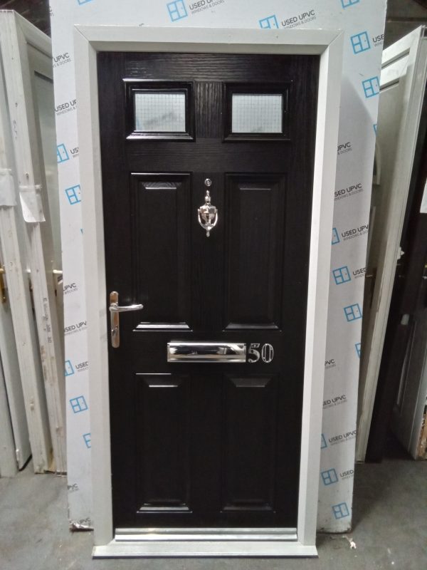 Used black on white composite front fire door 905mm x 1960mm 0813