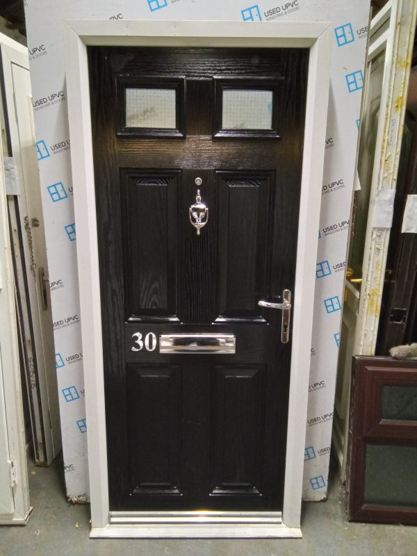 Used black onwhite composite front fire door 900mm x 1975mm 0848