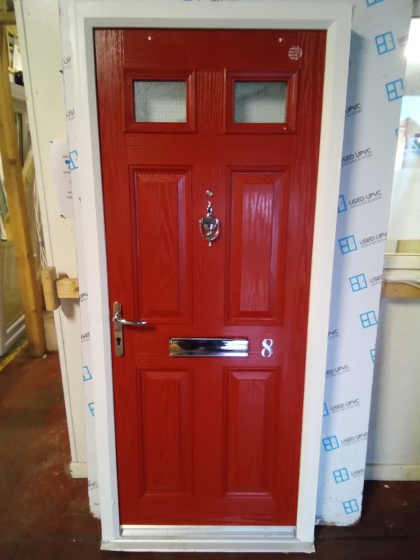 Used red composite front fire door 900mm x 2050mm C1D23