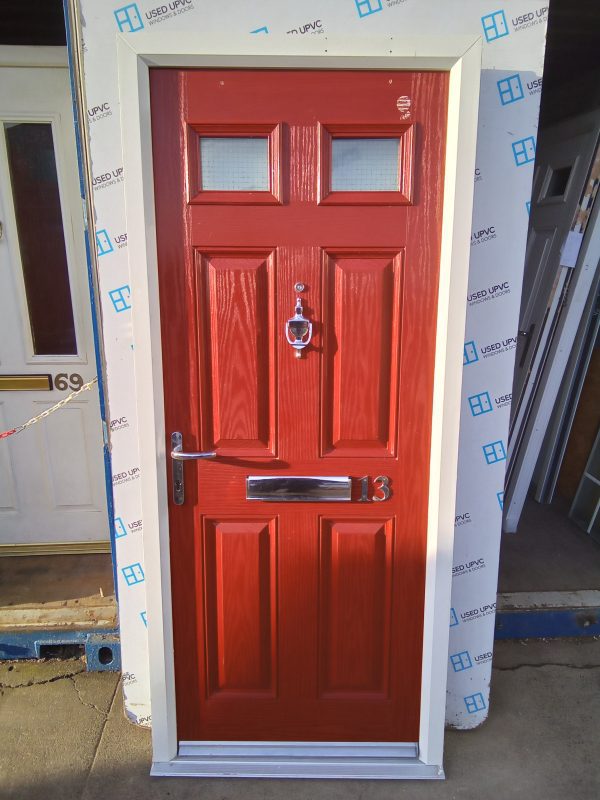 Used red composite front fire door 895mm x 2070mm C1D26